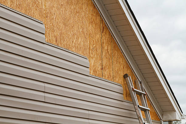 Professional Emergency Siding Repair technician working in Webster, IN